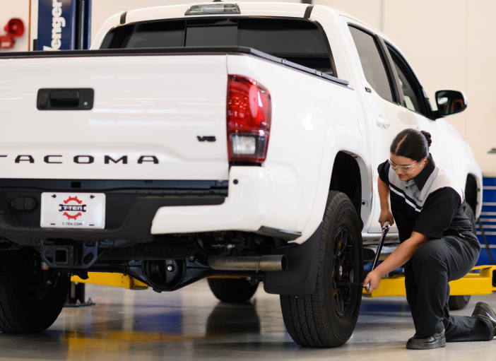 Technician changing truck tire